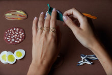 Load image into Gallery viewer, Hands wearing gold rings shaped like shark, cat, camera