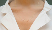 Load image into Gallery viewer, Yellow gold chain necklace with ring clasp worn by model