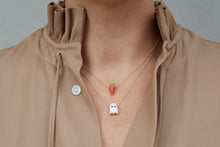 Load image into Gallery viewer, Model wearing gold chain necklaces with carrot shaped coral pendants and ghost shaped white coral pendant