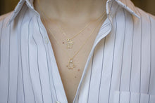 Load image into Gallery viewer, Gold chain necklace with family shaped pendant worn by model