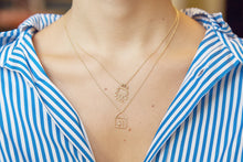 Load image into Gallery viewer, Gold chain necklaces with house and robot shaped pendants and small diamond worn by model