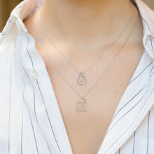 Load image into Gallery viewer, Model wearing white gold chain necklaces with house and light bulb chain pendants