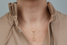Load image into Gallery viewer, Gold necklaces with house and martini drick shaped pendants worn by model