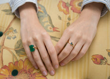 Load image into Gallery viewer, Hands wearing gold rings with precious stones