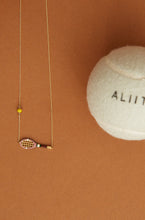 Load image into Gallery viewer, Gold chain necklace with gold tennis racquet and ball shaped pendants in pink and yellow enamel detail
