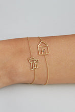 Load image into Gallery viewer, Gold chain bracelet with family shaped pendant worn by model