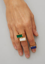 Load image into Gallery viewer, Hand wearing gold square rings with precious stones