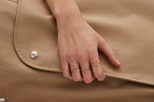 Load image into Gallery viewer, Gold dog shaped ring and small diamond worn by model