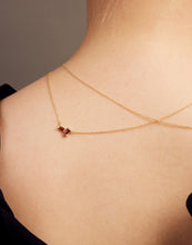 Load image into Gallery viewer, Gold rolo chain necklace with a baguett cut citrine and a baguette cut pink tourmaline on woman