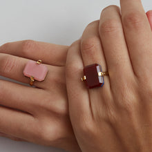 Load image into Gallery viewer, Gold turning ring with carnelian and pink oapl stones on woman's hands
