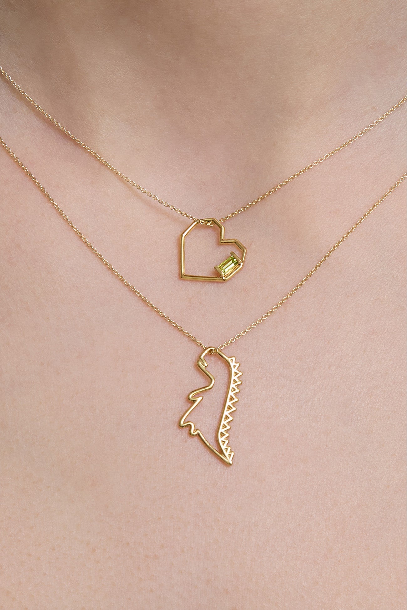Gold chain necklace with dinosaur shaped pendant