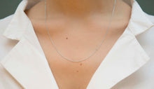 Load image into Gallery viewer, White gold chain necklace with ring clasp worn by model
