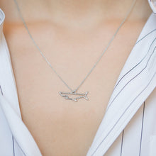 Load image into Gallery viewer, White gold chain necklace with shark shaped pendant worn by model
