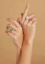 Load image into Gallery viewer, Gold rings with turquoise avocado and preciouse stones on model's hands

