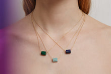 Load image into Gallery viewer, Woman wearing gold chain necklaces with cylinder cut stones
