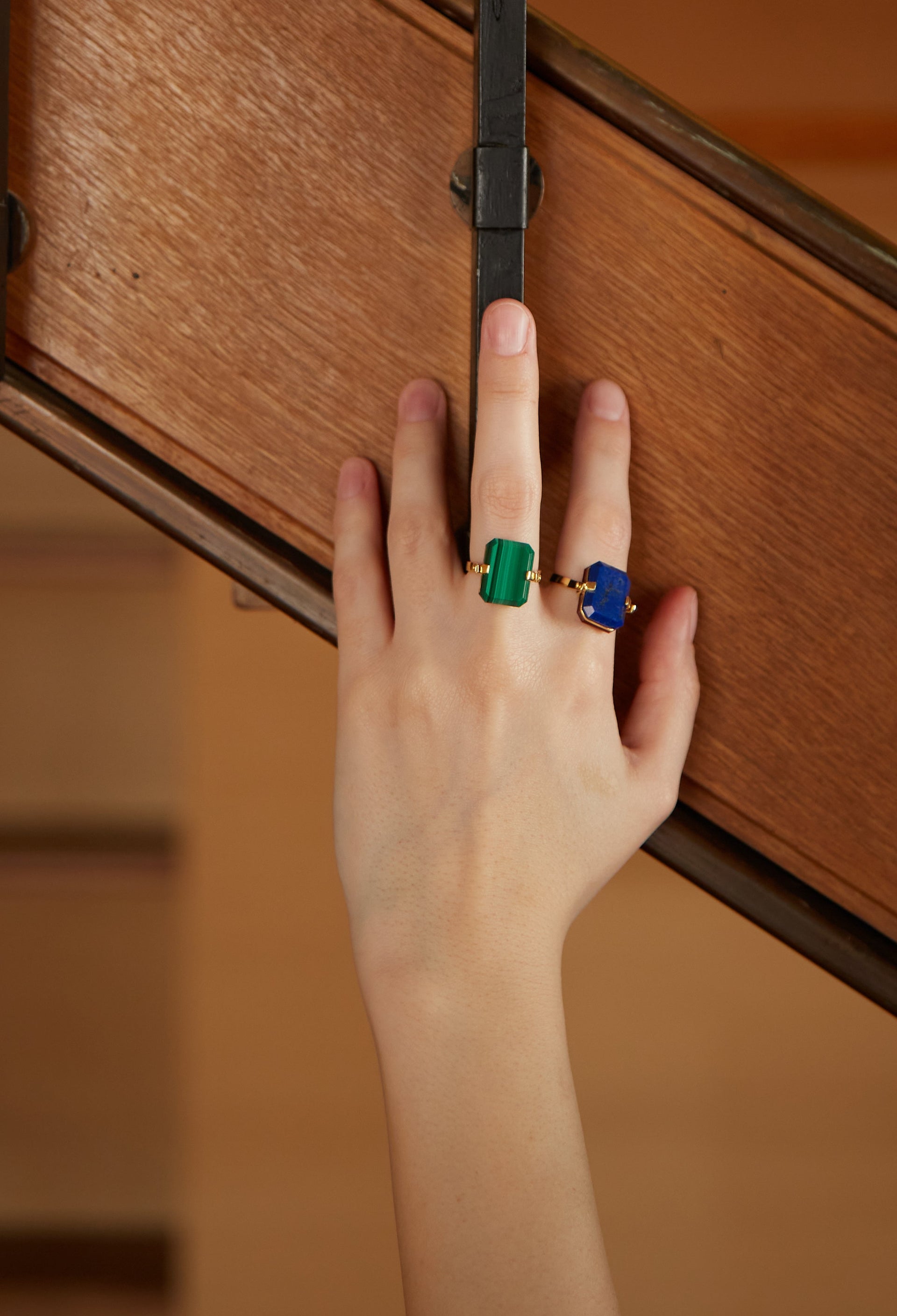 Gold ring with malachite and black agate stones